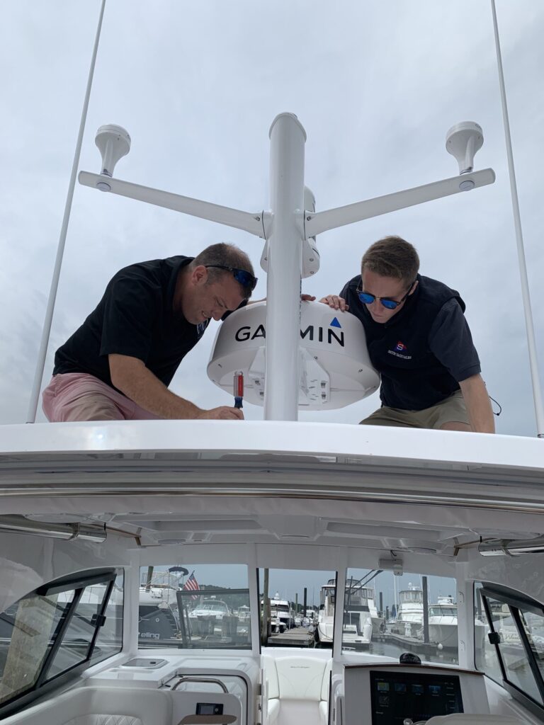 2 men installing a Garmin device